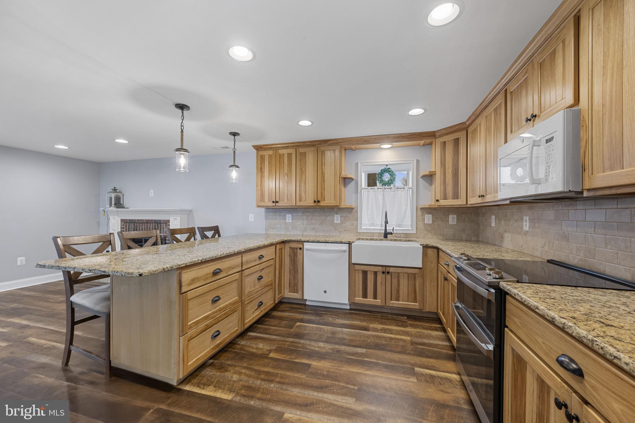 35 South Mcdermott Road, Unit A Pylesville, MD 21132 - Photo 11 of 35 a kitchen with a stove sink and cabinets