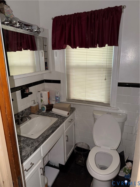 3605 Dill Road Richmond, VA 23222 - Photo 8 of 11 Bathroom featuring a white vanity with a patterned