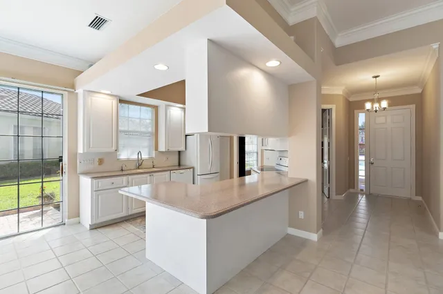 a view of cabinets and window in a room