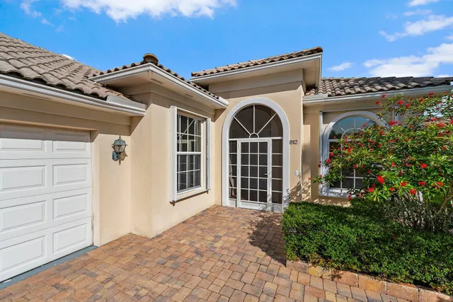 a spacious bathroom with a granite countertop sink and a large mirror