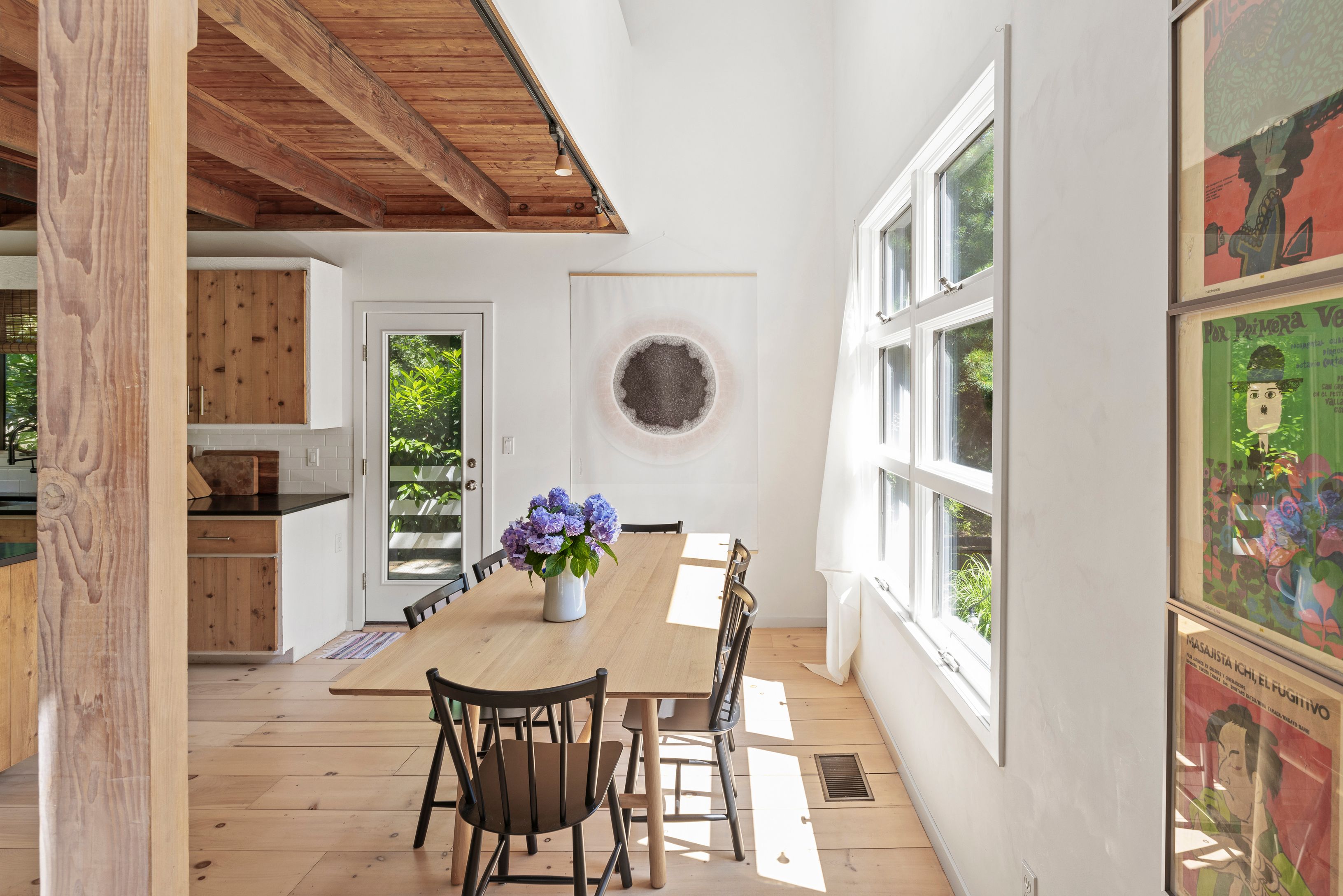 97 Swamp Road East Hampton, NY 11937 - Photo 13 of 28 a view of a dining room with furniture and a potted plant
