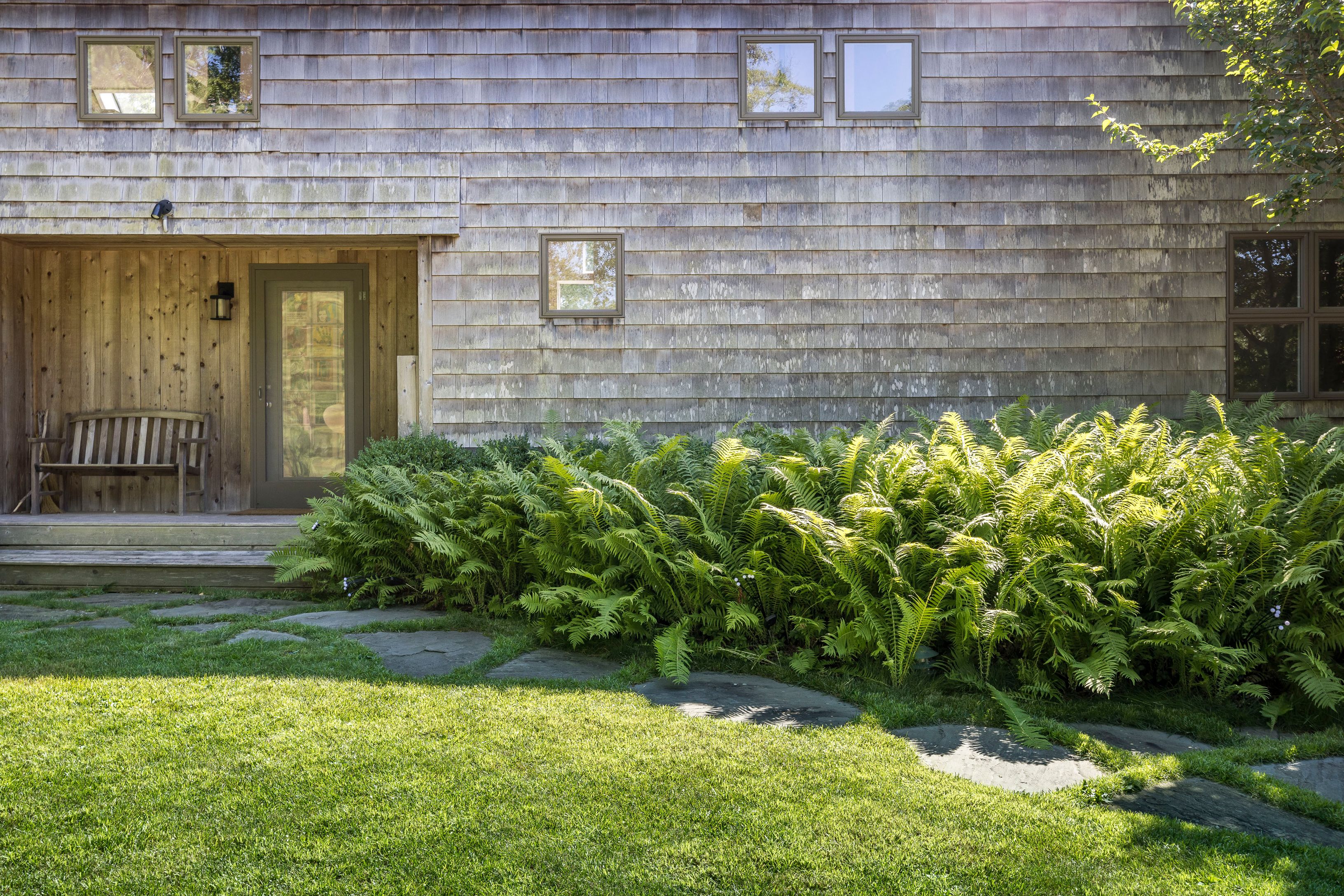 97 Swamp Road East Hampton, NY 11937 - Photo 23 of 28 a view of a backyard with plants