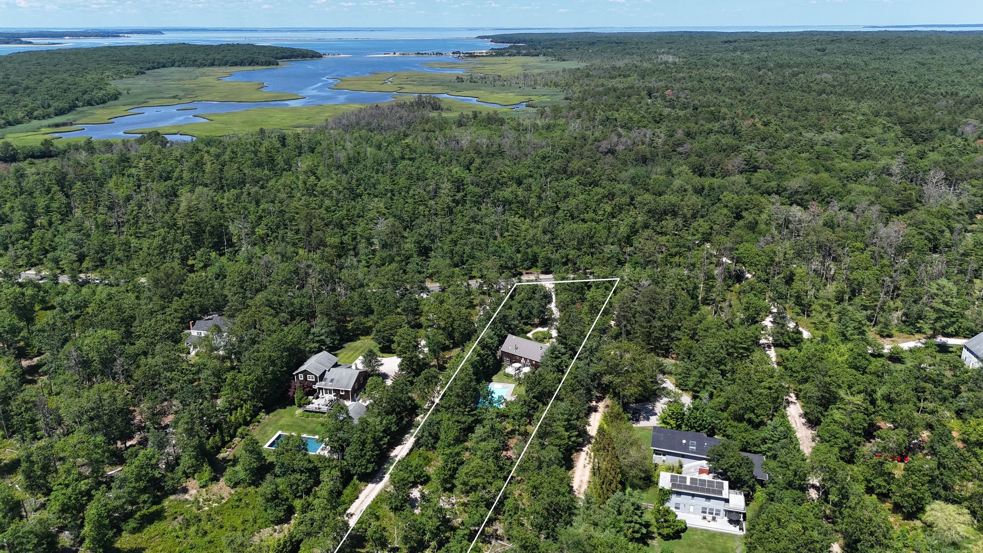 97 Swamp Road East Hampton, NY 11937 - Photo 28 of 28 an aerial view of a houses with a yard