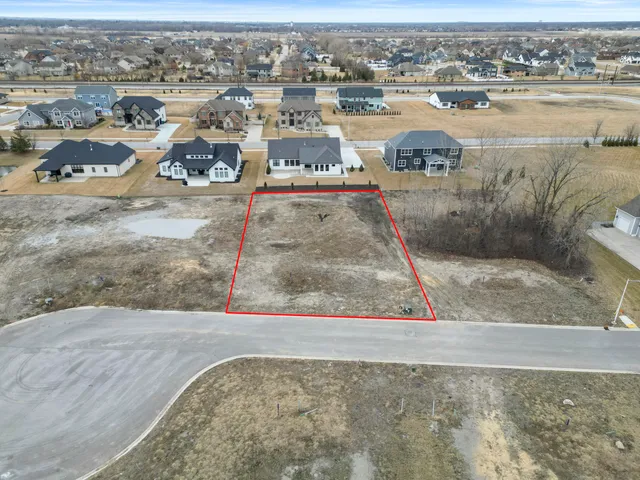 an aerial view of a house with outdoor space