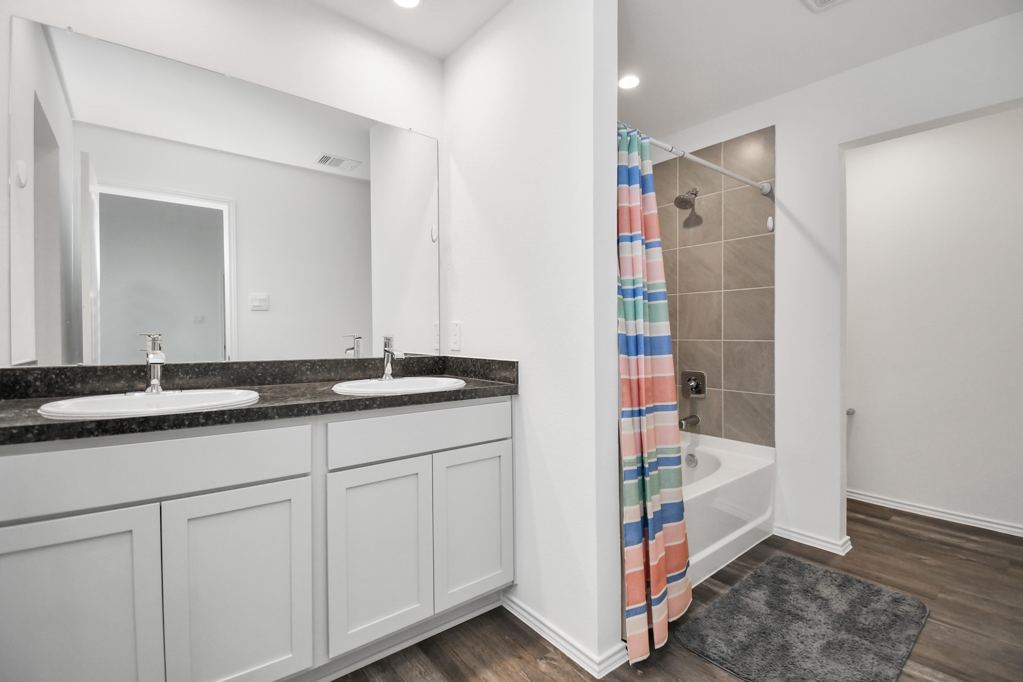 5315 Castlebury Meadows Dr Spring Spring, TX 77373 - Photo 28 of 39 a bathroom with a sink and a mirror