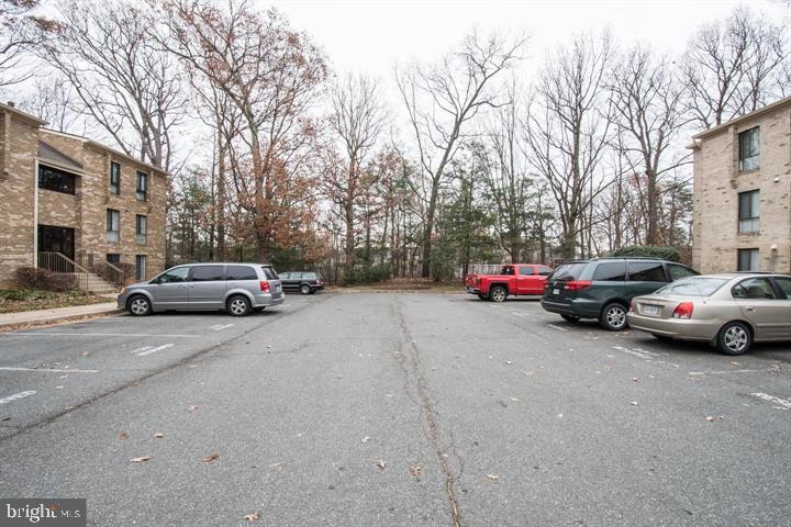 2311 Freetown Court, Unit 19/21C Reston, VA 20191 - Photo 15 of 20 a view of a cars parked on the side of a street