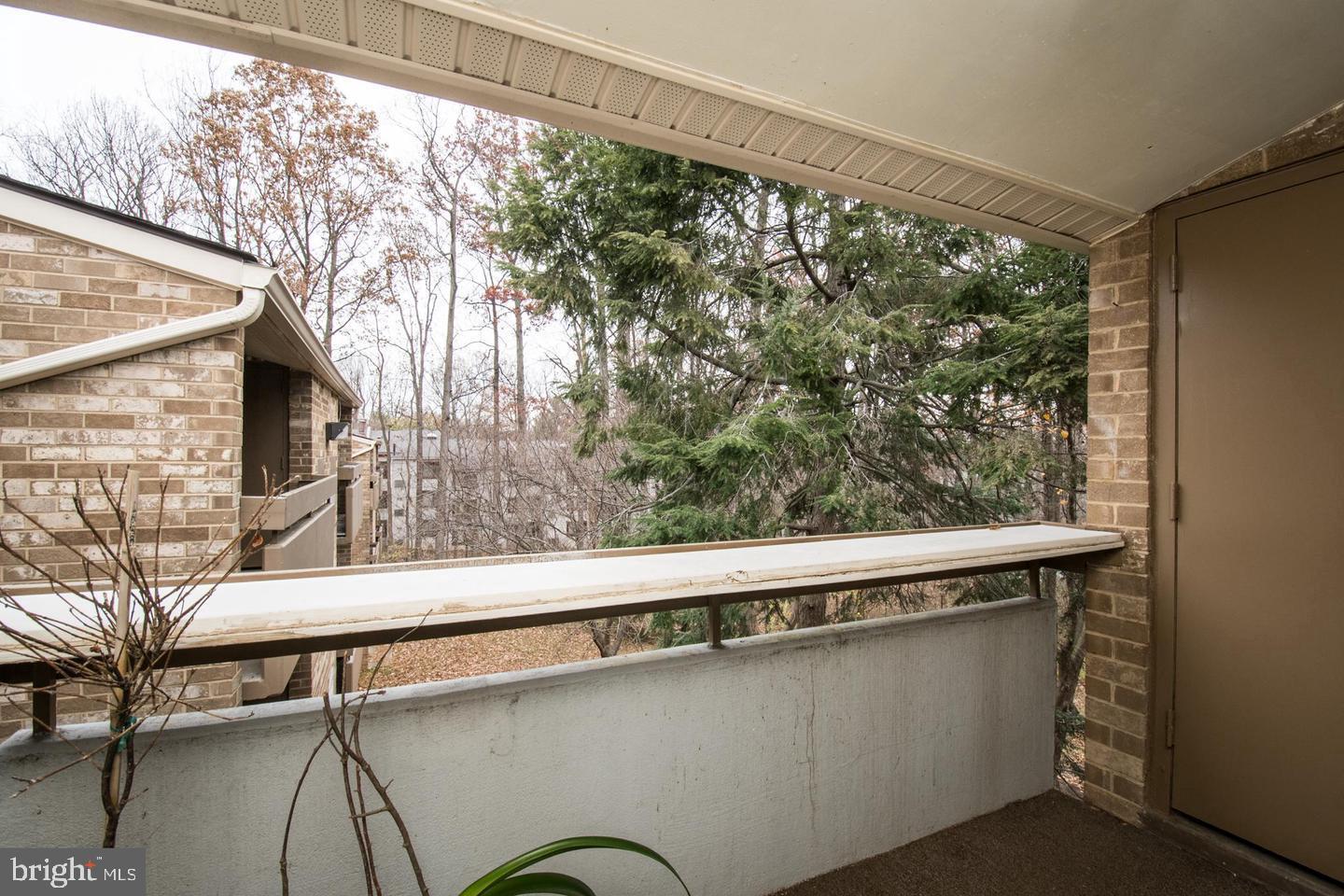 2311 Freetown Court, Unit 19/21C Reston, VA 20191 - Photo 3 of 20 a close up of a bench in a balcony
