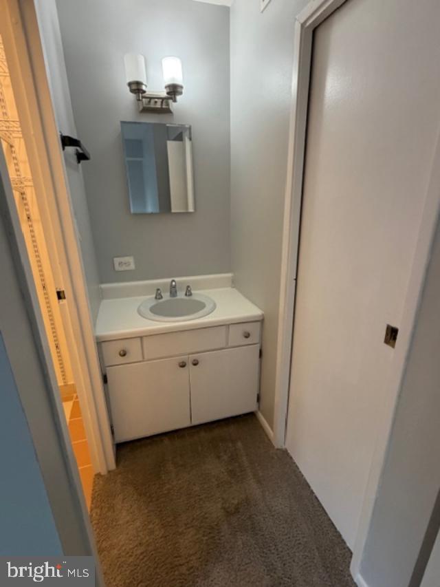 2311 Freetown Court, Unit 19/21C Reston, VA 20191 - Photo 7 of 20 a room with a sink and a mirror