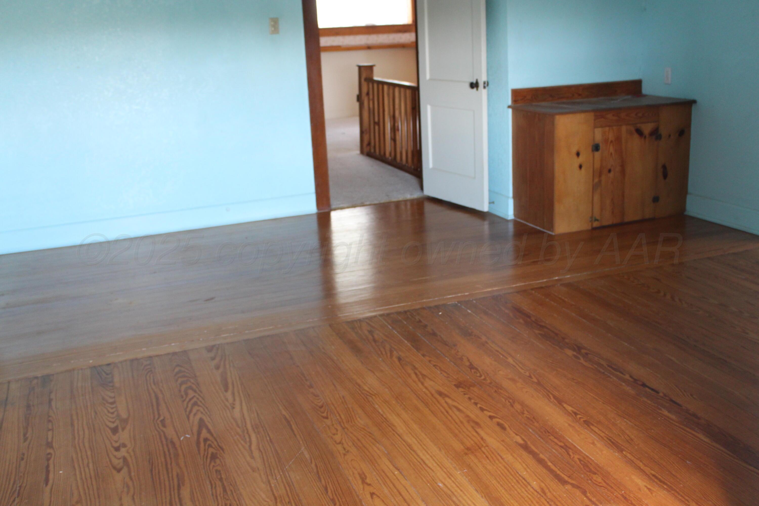 14330 Broome Road Memphis, TX 79245 - Photo 12 of 63 a view of a hallway with wooden floor