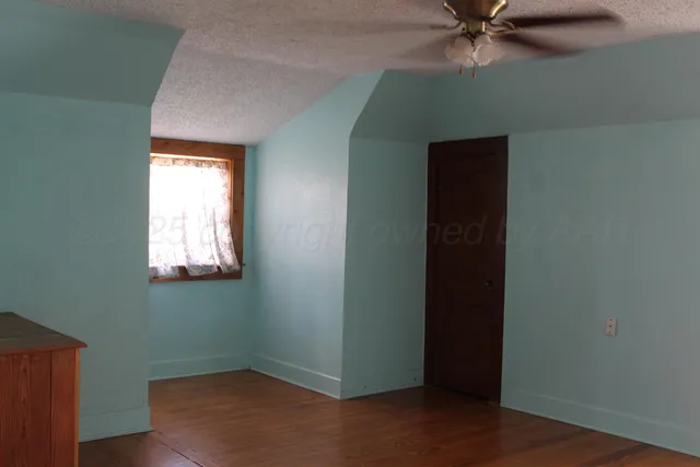 a bathroom with a sink mirror and vanity