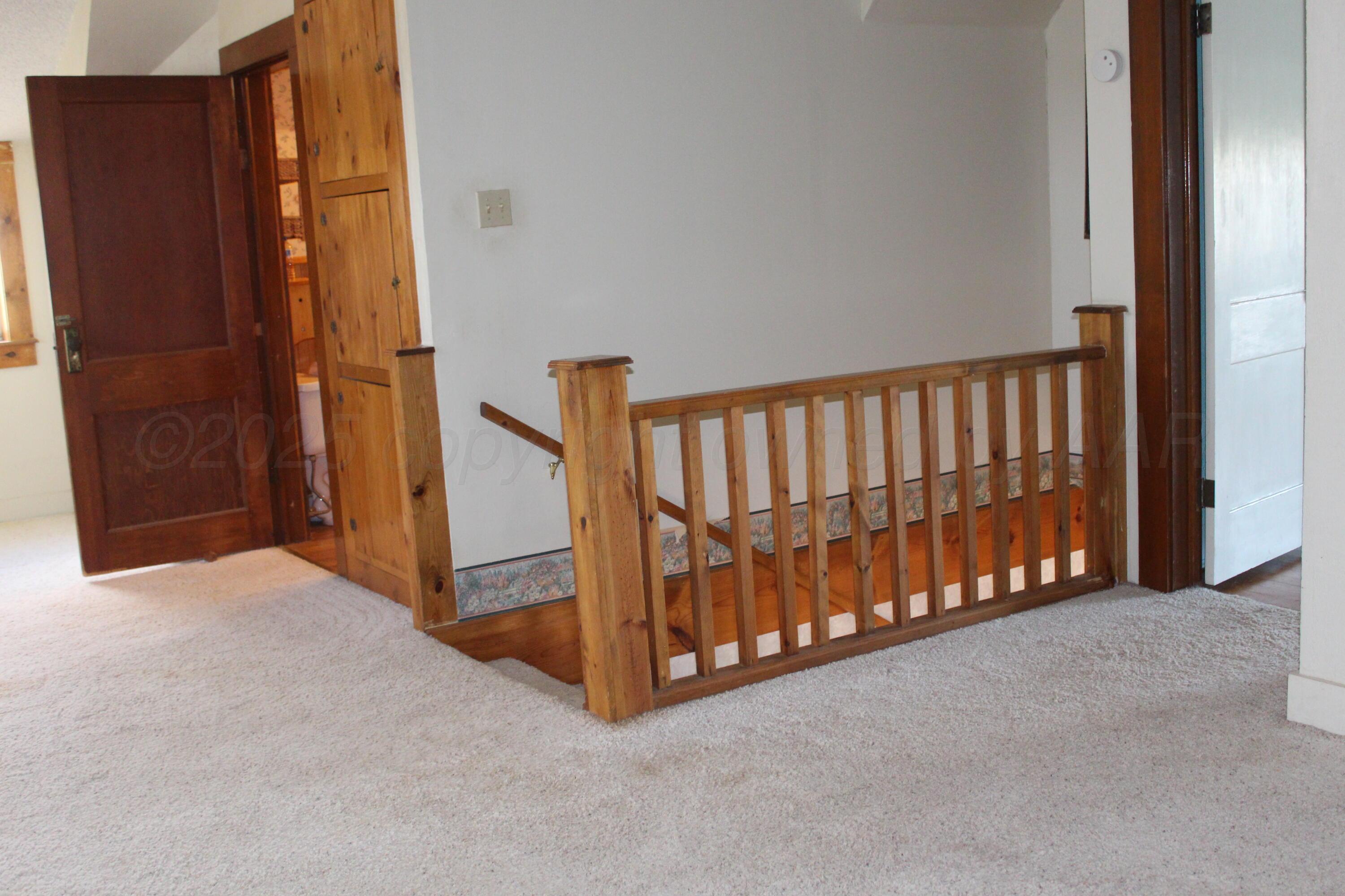 14330 Broome Road Memphis, TX 79245 - Photo 19 of 63 a view of a hallway with staircase