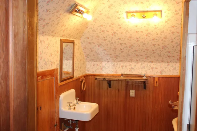 a bath tub sitting next to a white sink