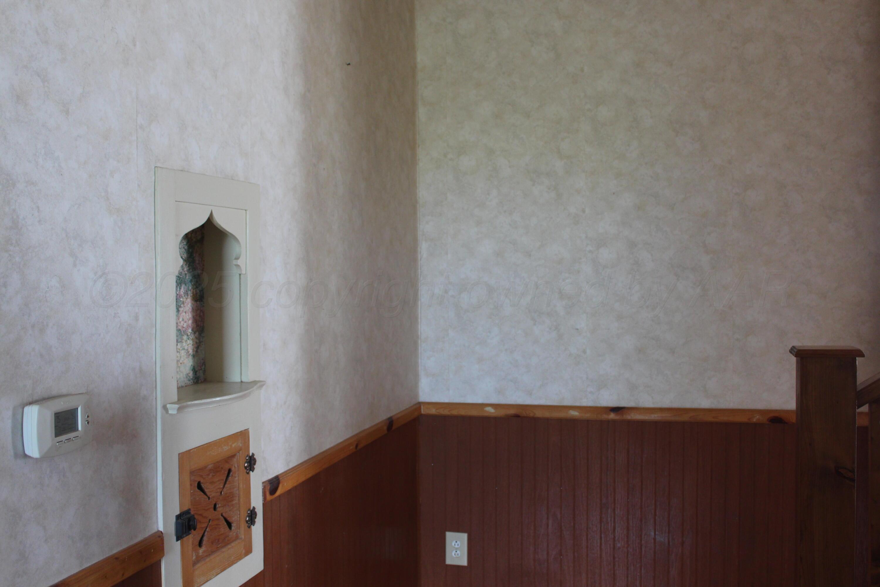 14330 Broome Road Memphis, TX 79245 - Photo 28 of 63 a view of wooden floor and cabinet