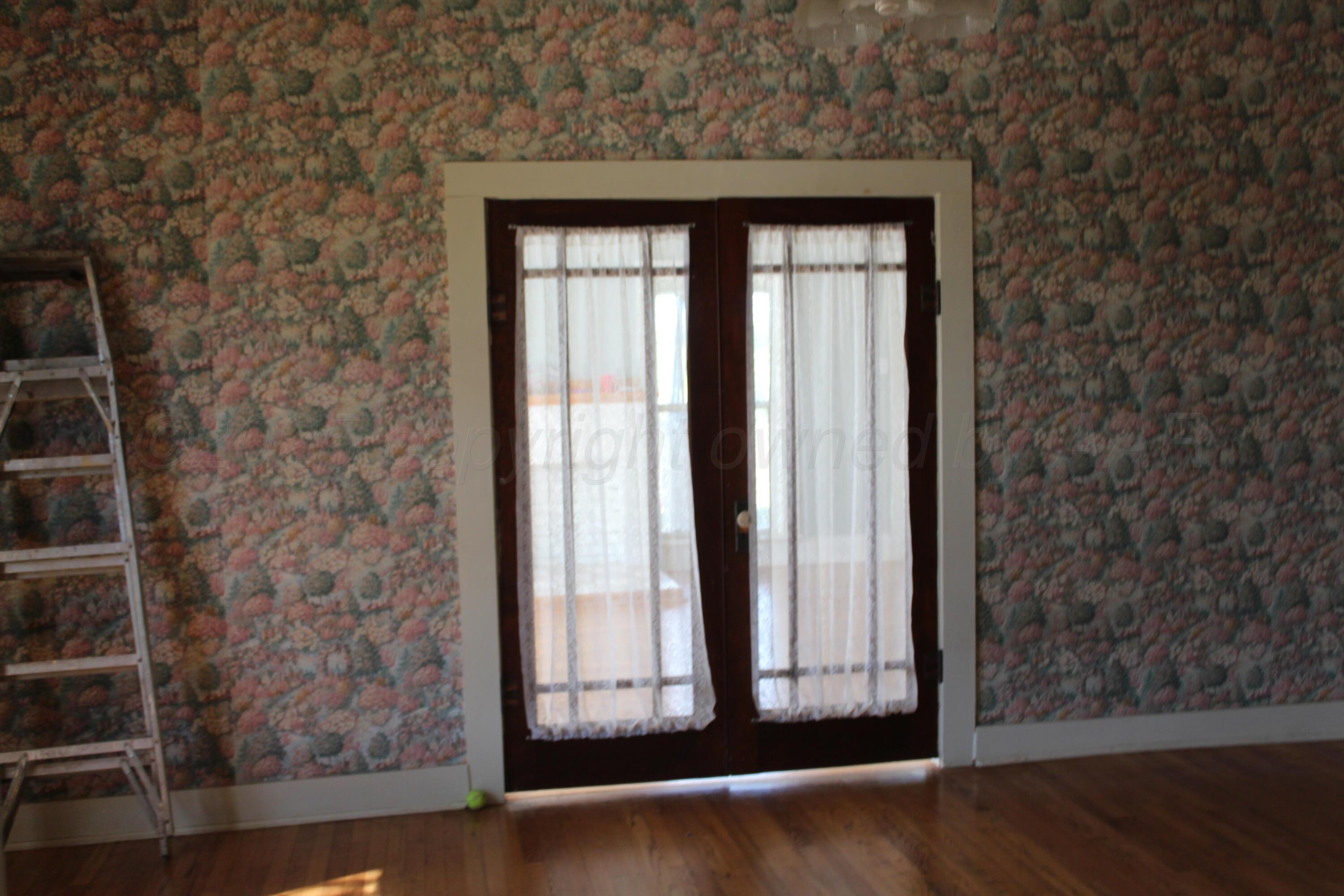 14330 Broome Road Memphis, TX 79245 - Photo 37 of 63 an empty room with wooden floor and windows