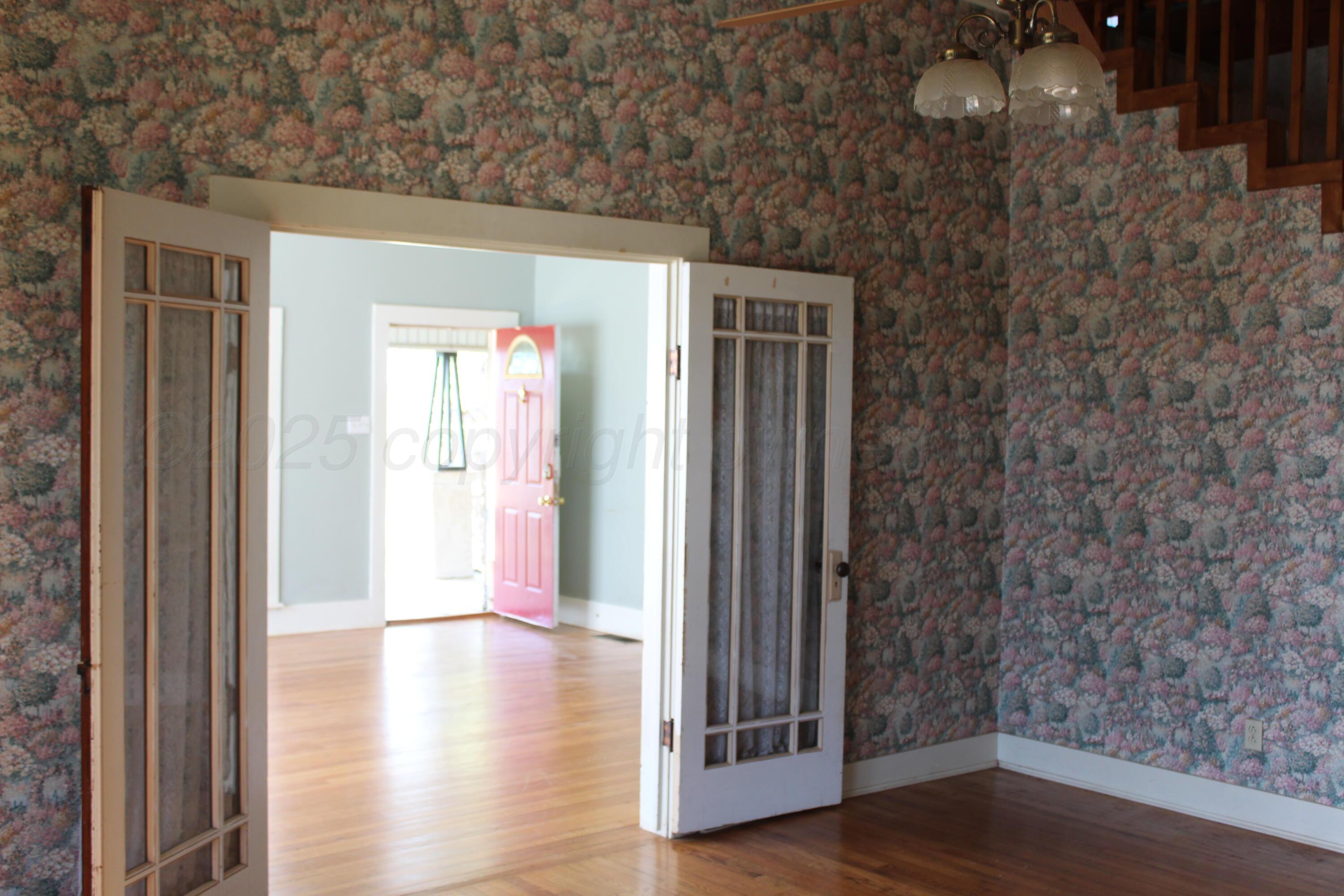 14330 Broome Road Memphis, TX 79245 - Photo 41 of 63 a view of a hallway with wooden floor