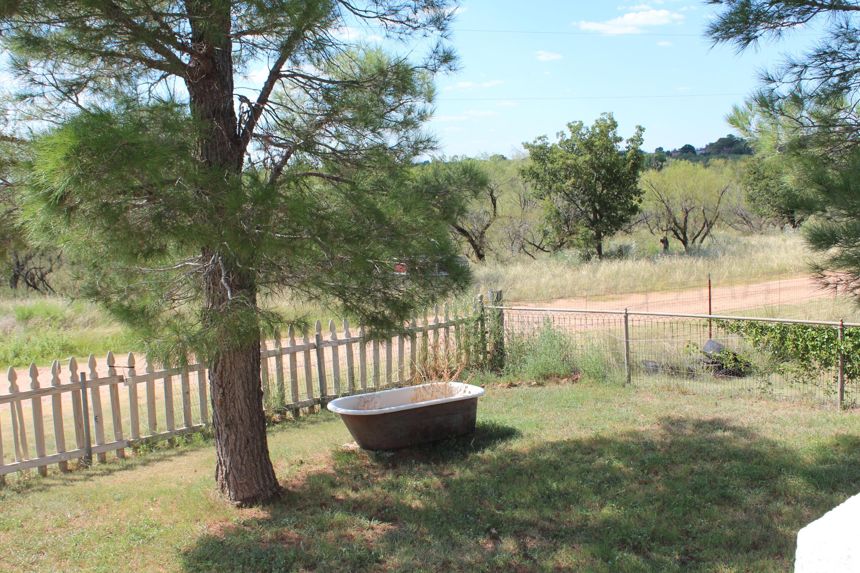 14330 Broome Road Memphis, TX 79245 - Photo 5 of 63 a view of a bench in the garden