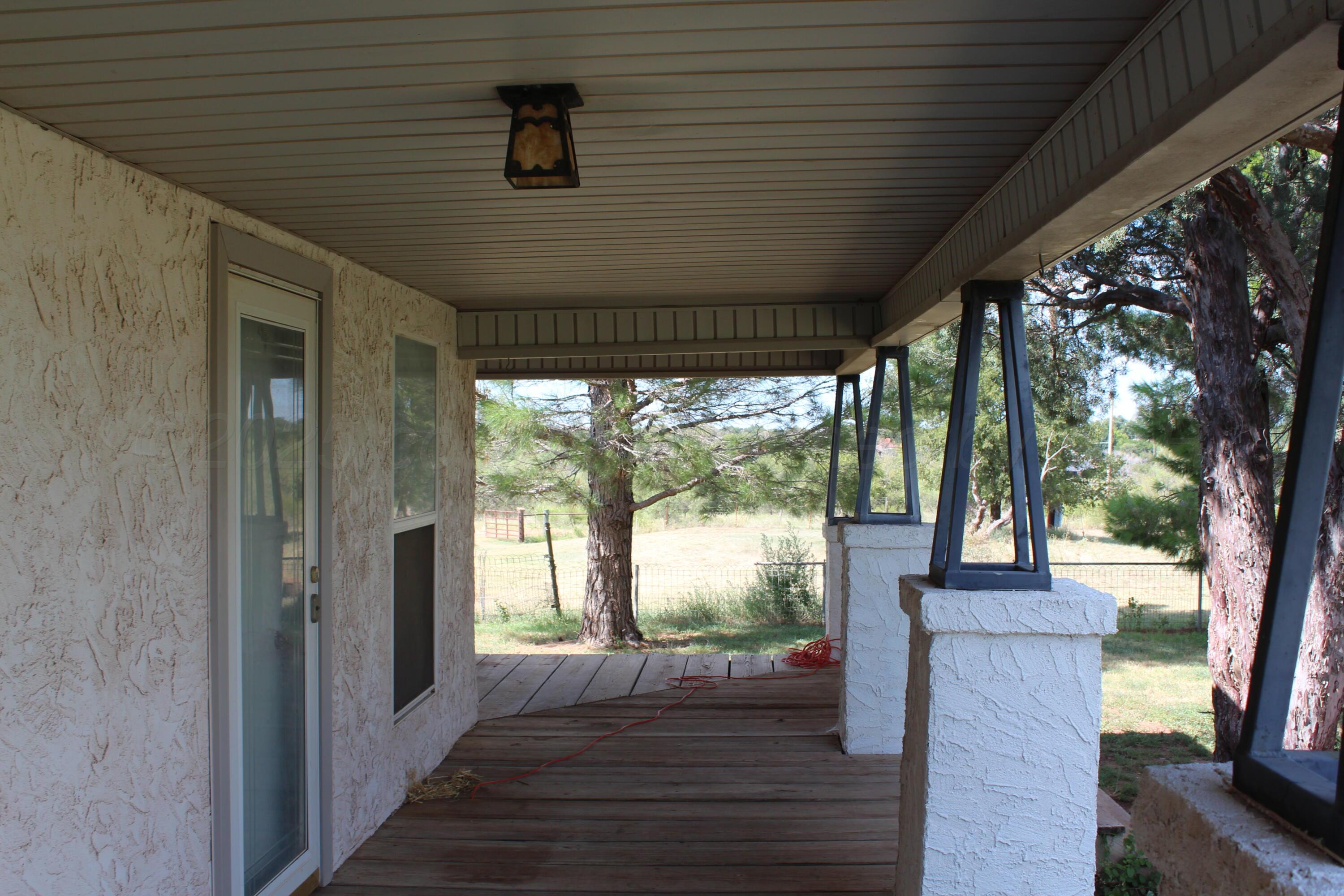 14330 Broome Road Memphis, TX 79245 - Photo 51 of 63 a porch with wooden floor and outdoor space