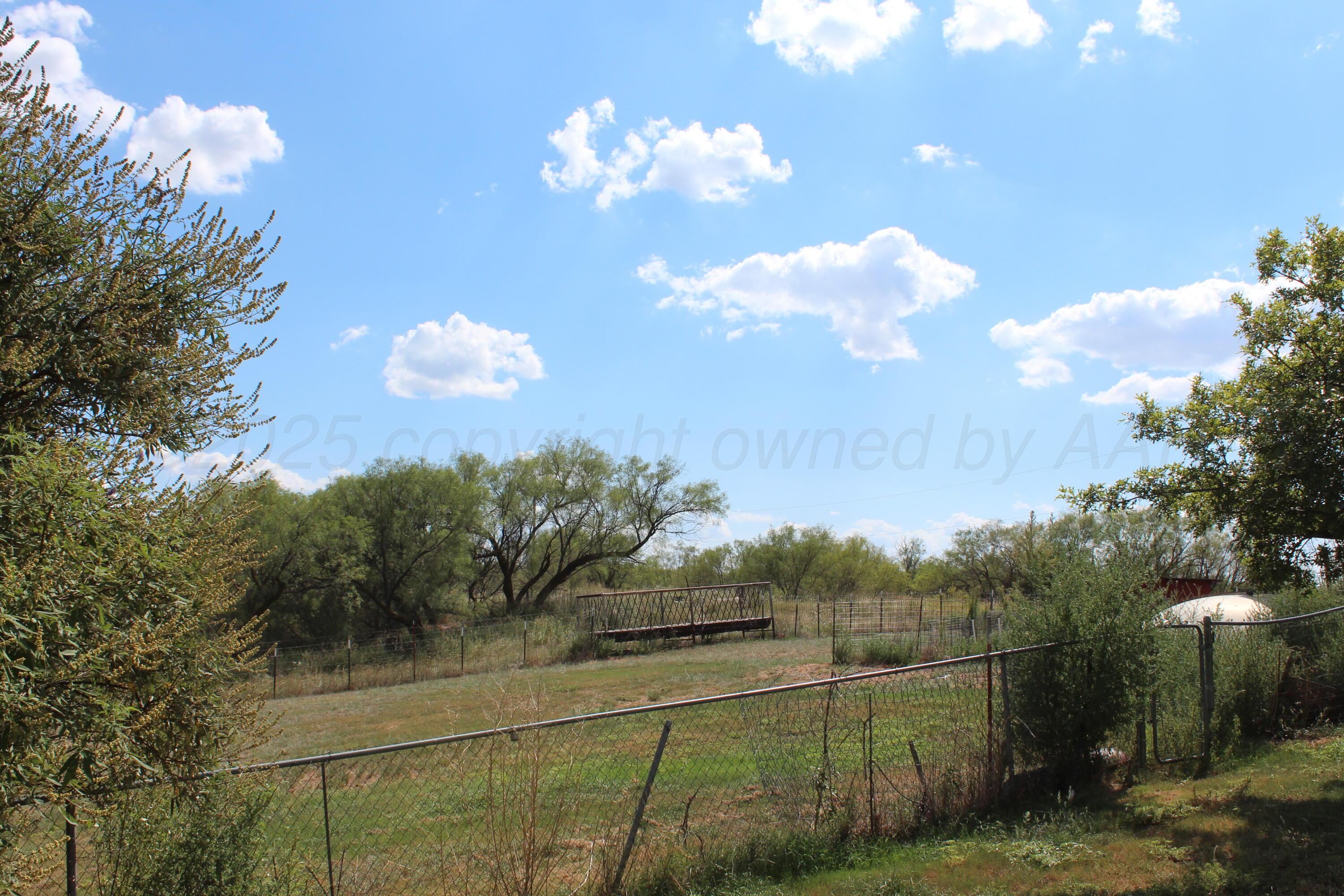 14330 Broome Road Memphis, TX 79245 - Photo 53 of 63 a view of a fountain in a backyard