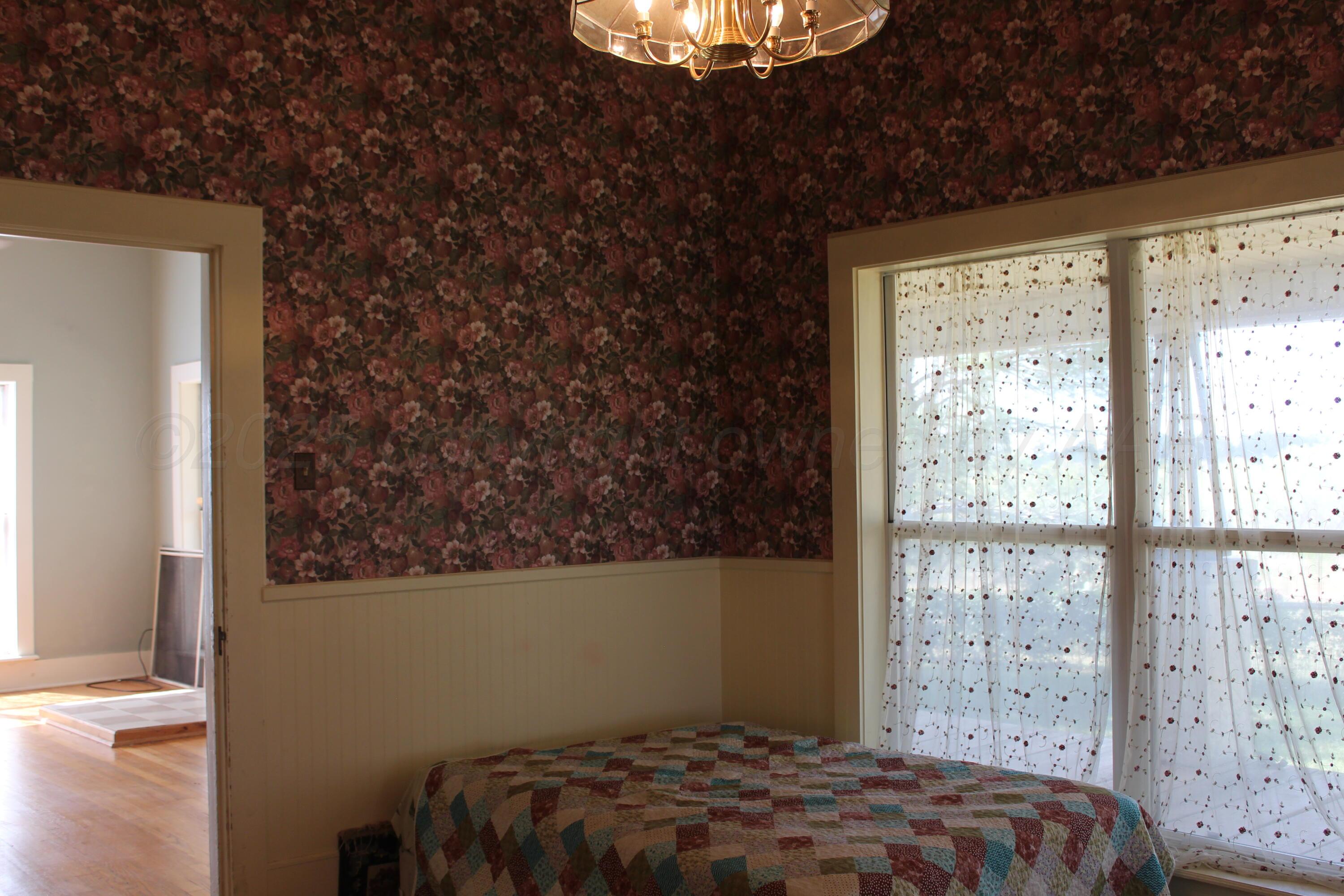 14330 Broome Road Memphis, TX 79245 - Photo 9 of 63 a bedroom with a bed and a window