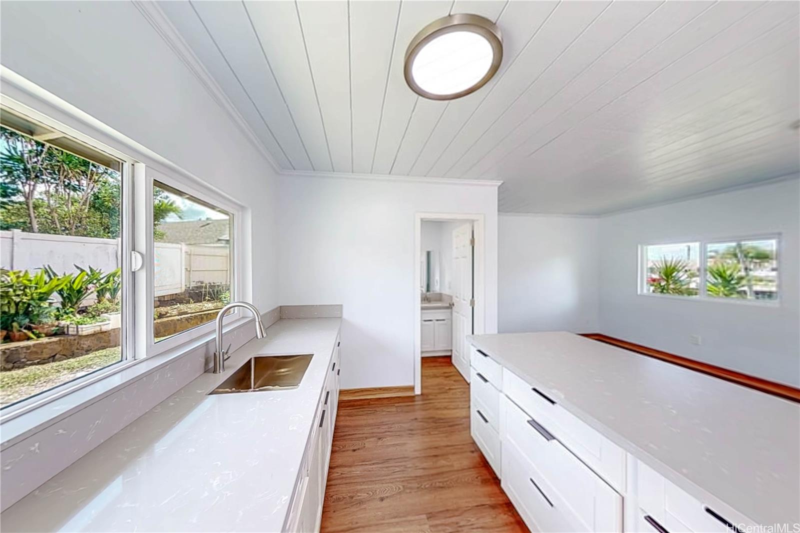 1543 Mahie Place Honolulu, HI 96818 - Photo 13 of 25 wooden floor in an empty room with a window