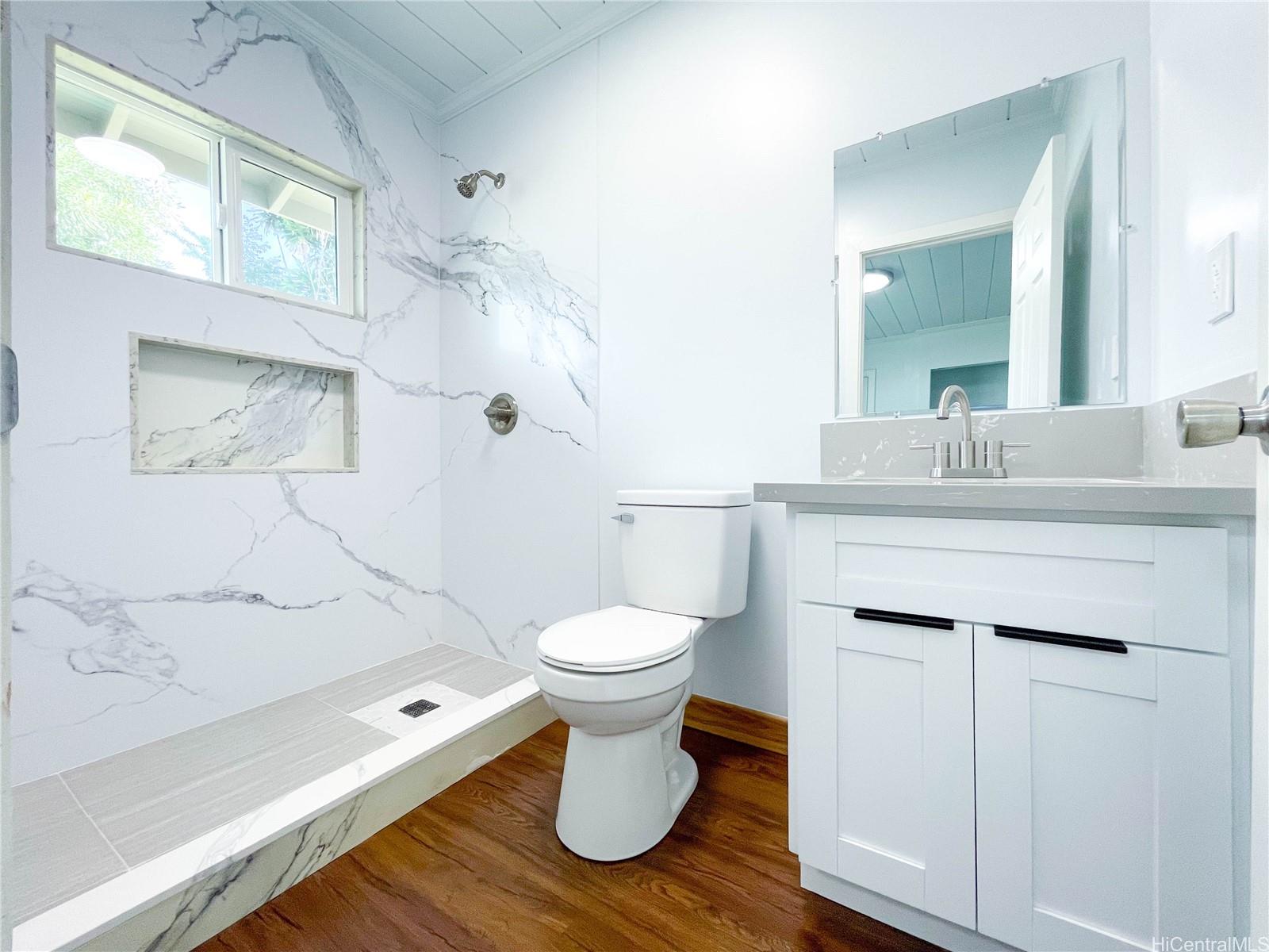 1543 Mahie Place Honolulu, HI 96818 - Photo 14 of 25 a bathroom with a sink toilet and shower