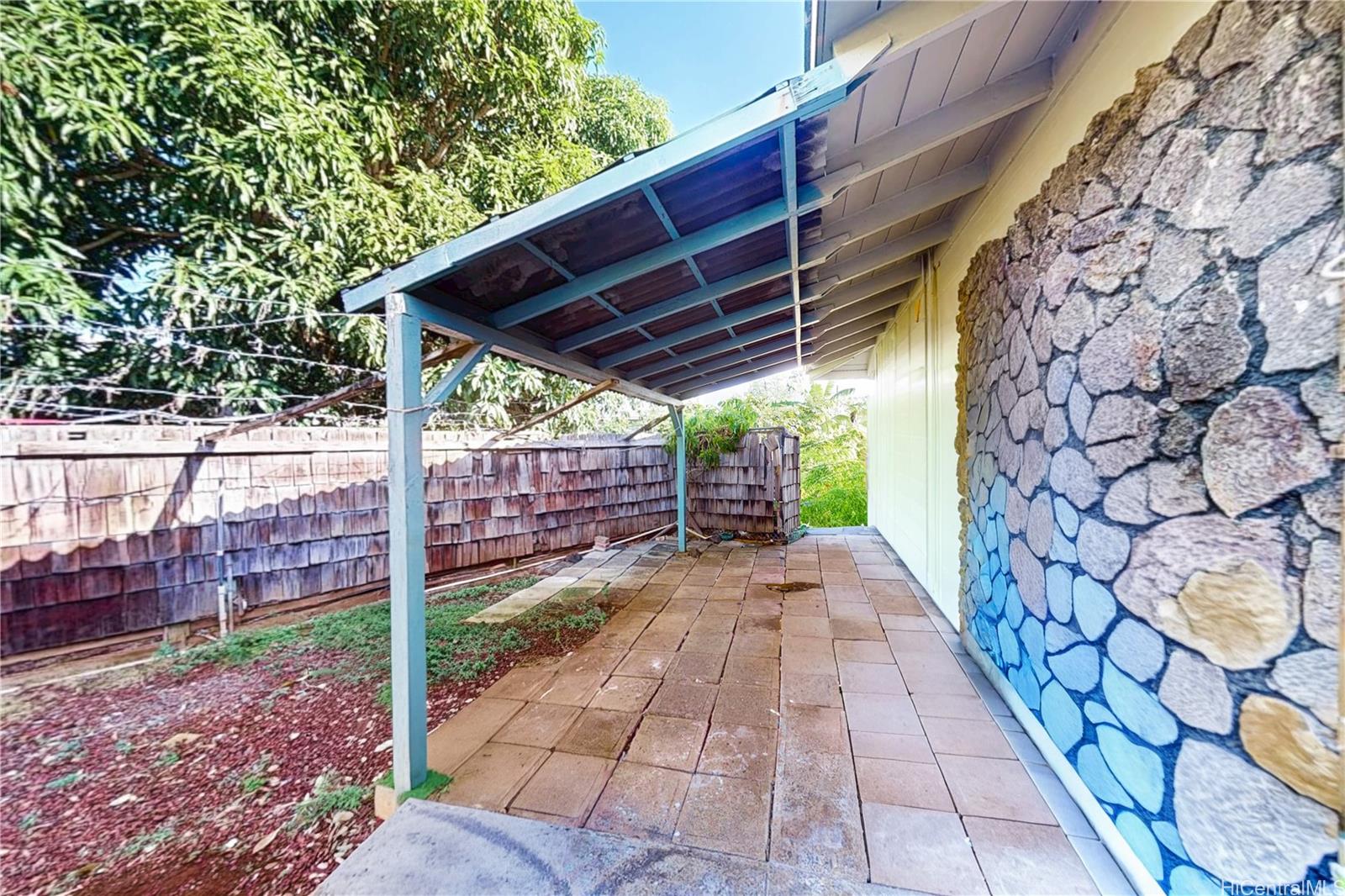 1543 Mahie Place Honolulu, HI 96818 - Photo 15 of 25 a view of a backyard with wooden fence and floor