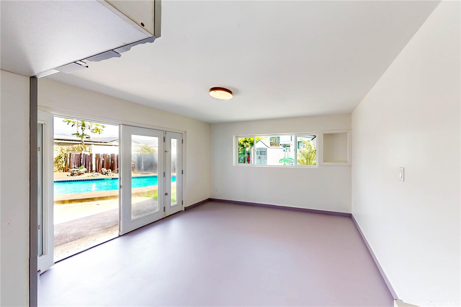 1543 Mahie Place Honolulu, HI 96818 - Photo 19 of 25 an empty room with outdoor view and windows