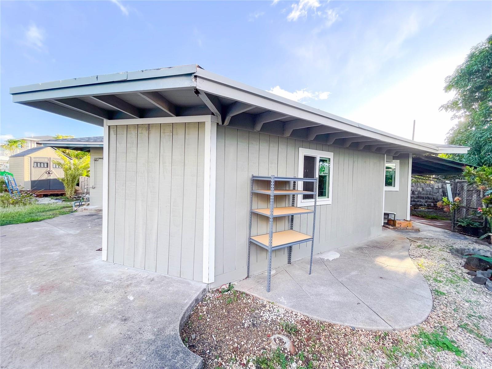 1543 Mahie Place Honolulu, HI 96818 - Photo 21 of 25 a view of a house with backyard and sitting area