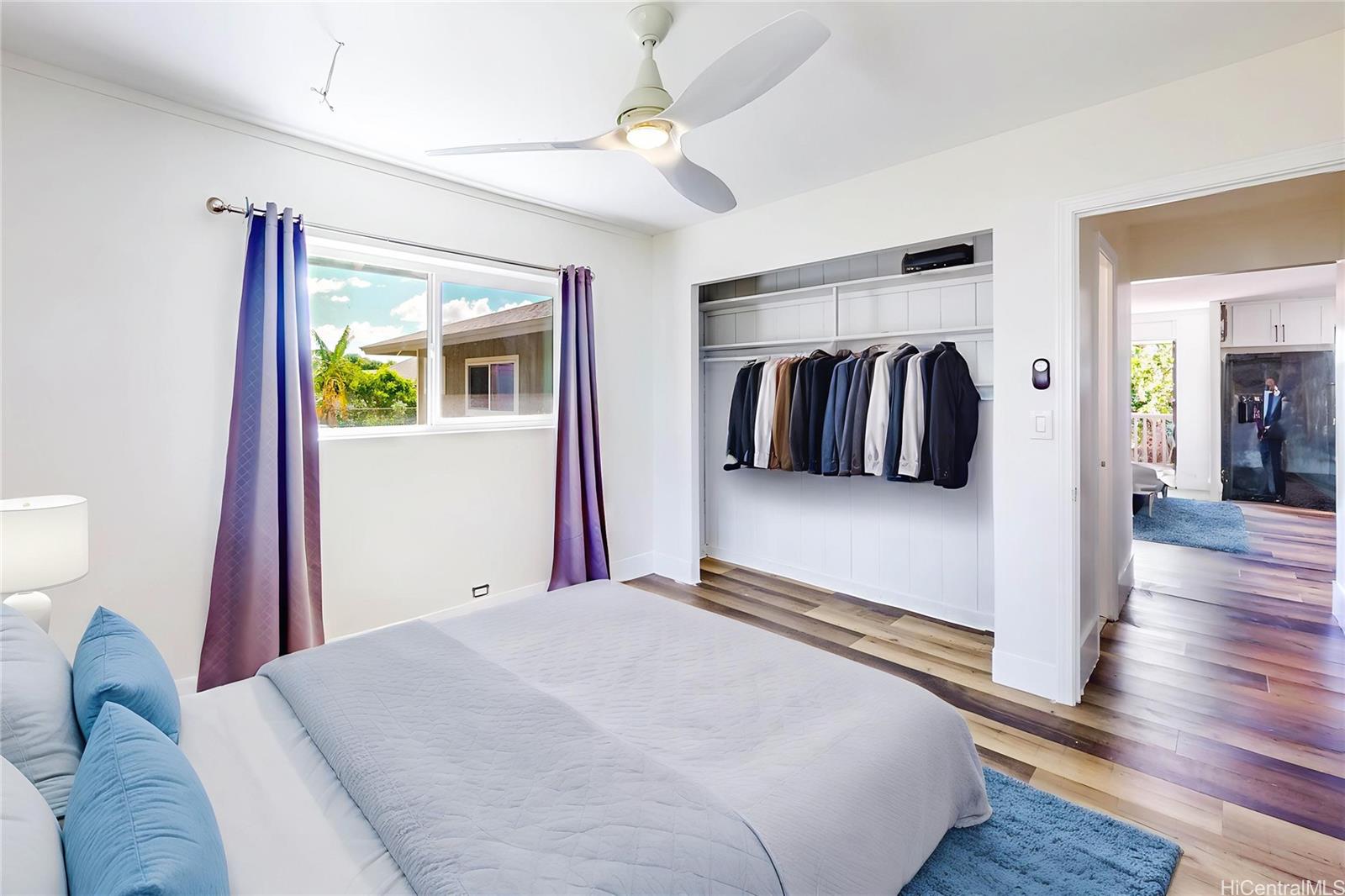 1543 Mahie Place Honolulu, HI 96818 - Photo 6 of 25 a bedroom with a large bed and a window