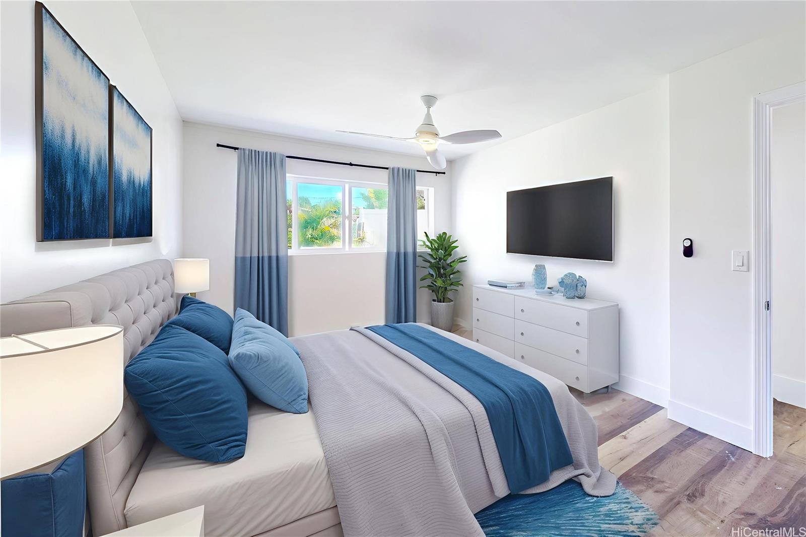 1543 Mahie Place Honolulu, HI 96818 - Photo 7 of 25 a bedroom with a bed and a flat screen tv