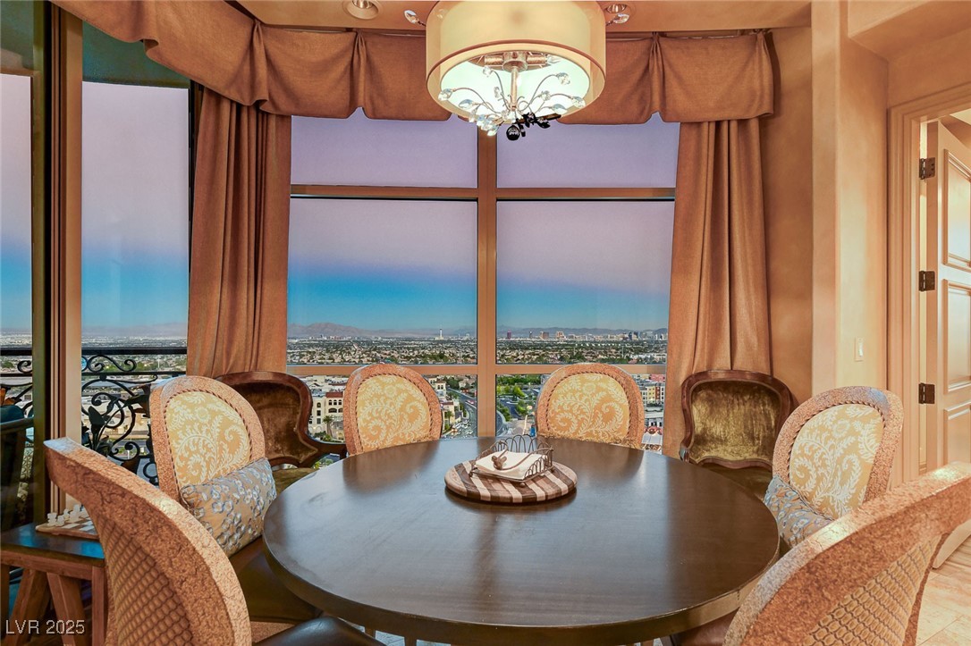 9101 Alta Drive, Unit 1406 Las Vegas, NV 89145 - Photo 4 of 69 Dining area with a chandelier