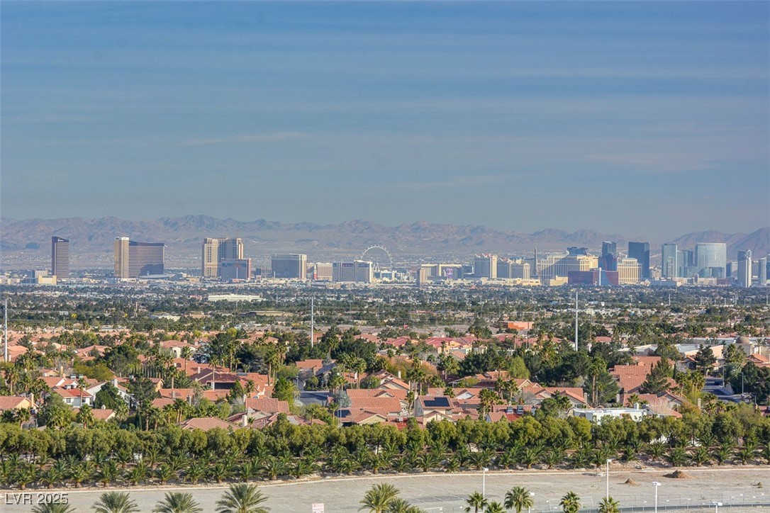 9101 Alta Drive, Unit 1406 Las Vegas, NV 89145 - Photo 46 of 69 Aerial view of property and surrounding area with nearby urban area and a mountainous background
