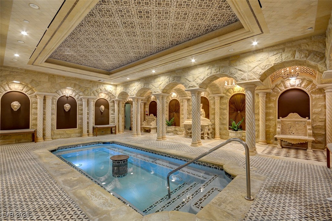 9101 Alta Drive, Unit 1406 Las Vegas, NV 89145 - Photo 65 of 69 Indoor pool with decorative columns