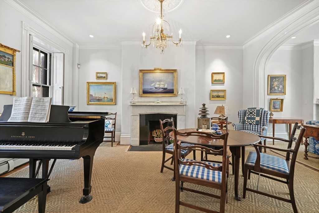 32 West Cedar Street Boston, MA 02108 - Photo 9 of 39 a view of a dining room with furniture and a chandelier