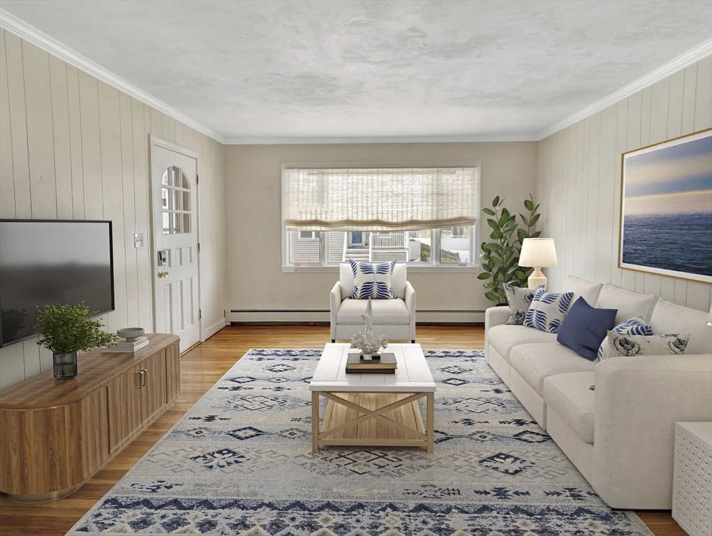 48 A B Street Hull, MA 02045 - Photo 8 of 41 a living room with furniture and a flat screen tv