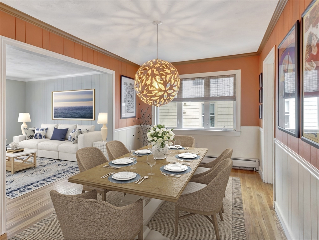 48 A B Street Hull, MA 02045 - Photo 9 of 41 a view of a dining room with furniture wooden floor and chandelier