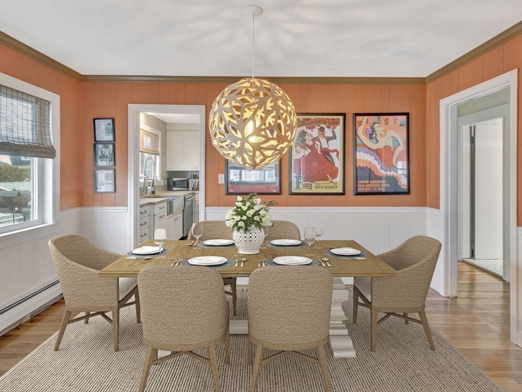 48 A B Street Hull, MA 02045 - Photo 10 of 41 a dining room with furniture a painting and a potted plant