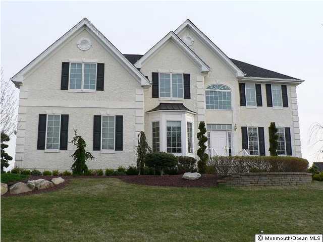 419 East Freehold Road Freehold, NJ 07728 - Photo 1 of 1 a front view of a house with a yard