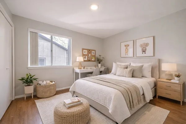a bedroom with a bed and a couch
