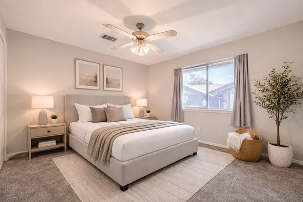 a bedroom with a bed and window