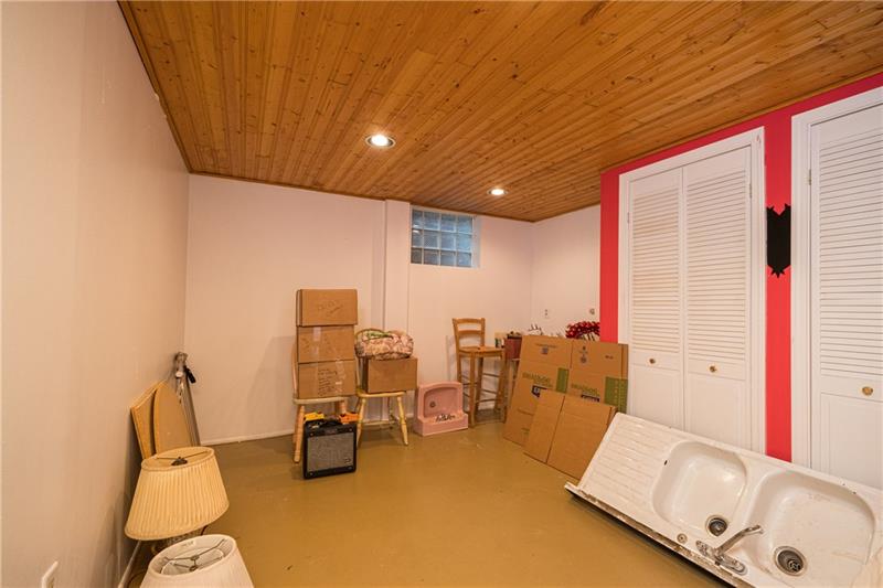 128 Marlboro Road Pittsburgh, PA 15238 - Photo 16 of 21 Separate finished room in basement with glass block window. Currently used as storage space.