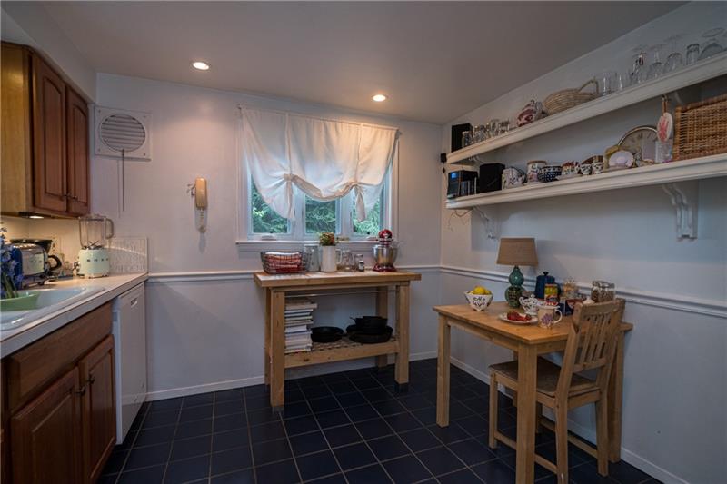 Eat-In-Kitchen.  Shelving remains with property.  