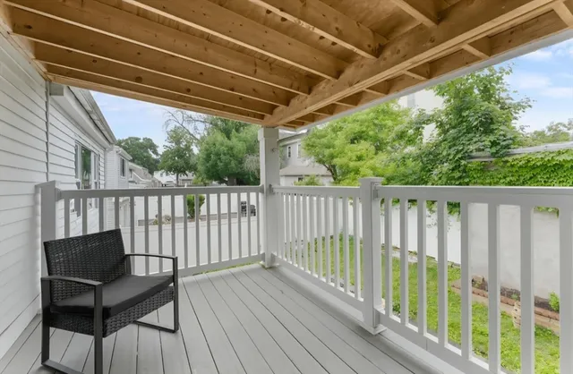 a view of a two chairs in the balcony