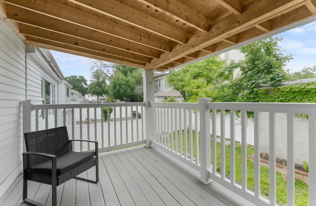 44 Woodlawn Avenue, Unit 2 Everett, MA 02149 - Photo 18 of 18 a view of a two chairs in the balcony
