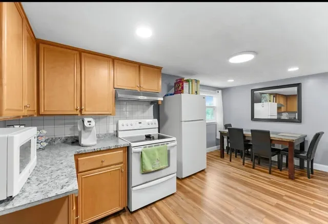 a kitchen that has a cabinets counter space and appliances