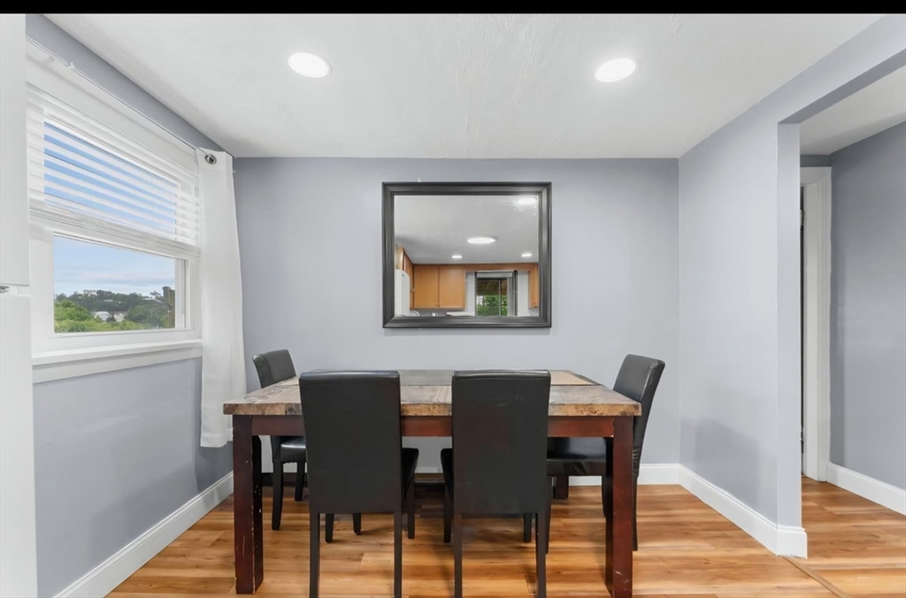 44 Woodlawn Avenue, Unit 2 Everett, MA 02149 - Photo 6 of 18 a view of a dining room with furniture and wooden floor