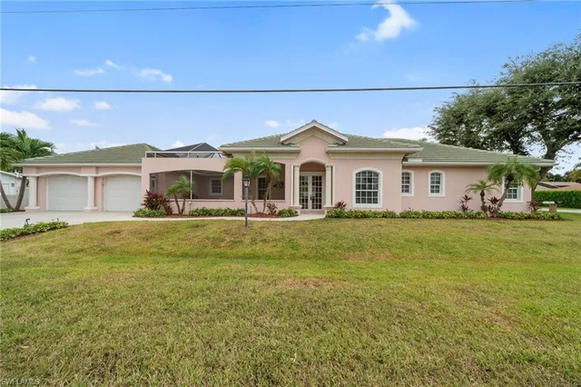 a front view of a house with a garden