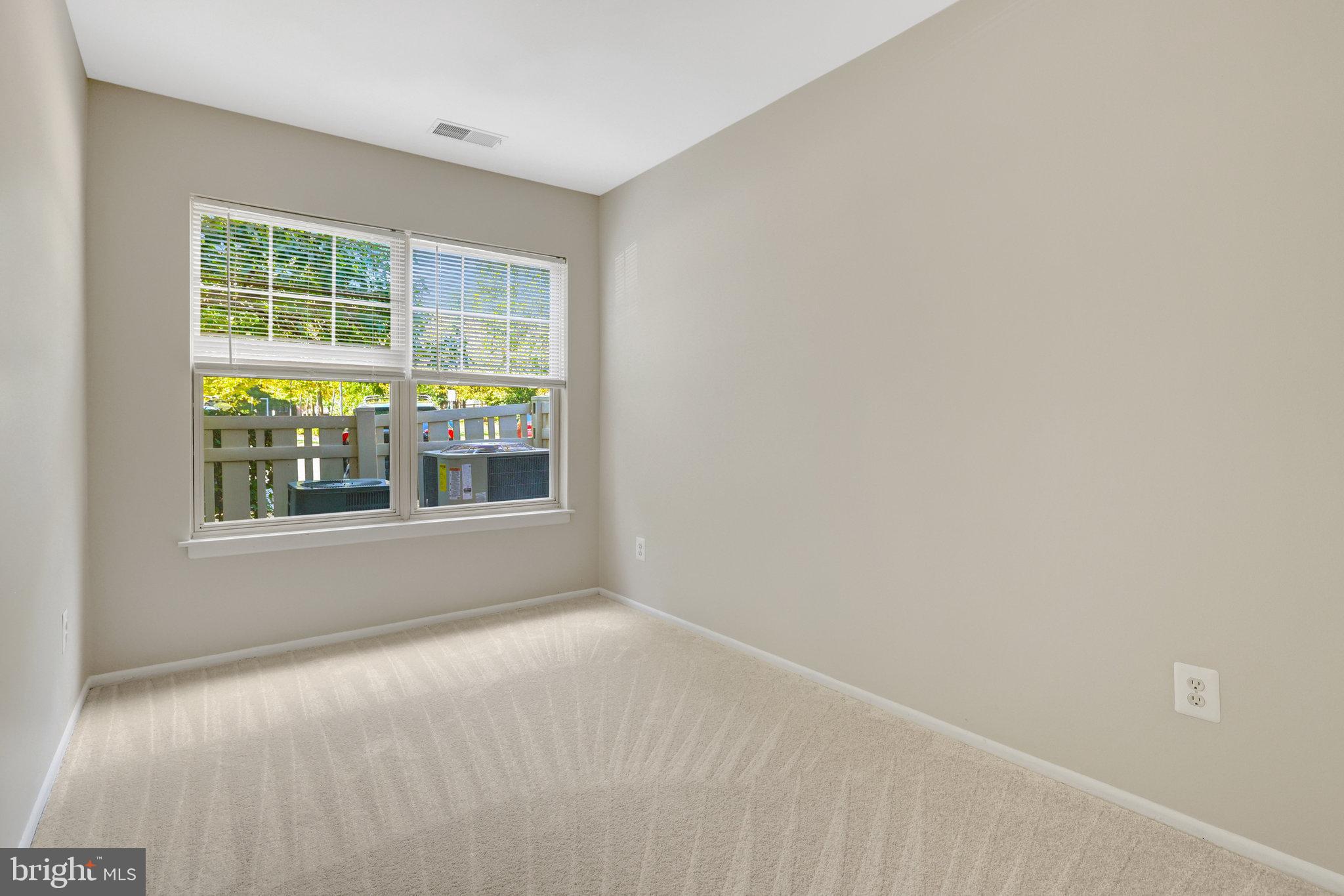 1791 Jonathan Way, Unit 1791B Reston, VA 20190 - Photo 13 of 27 a view of an empty room with a window
