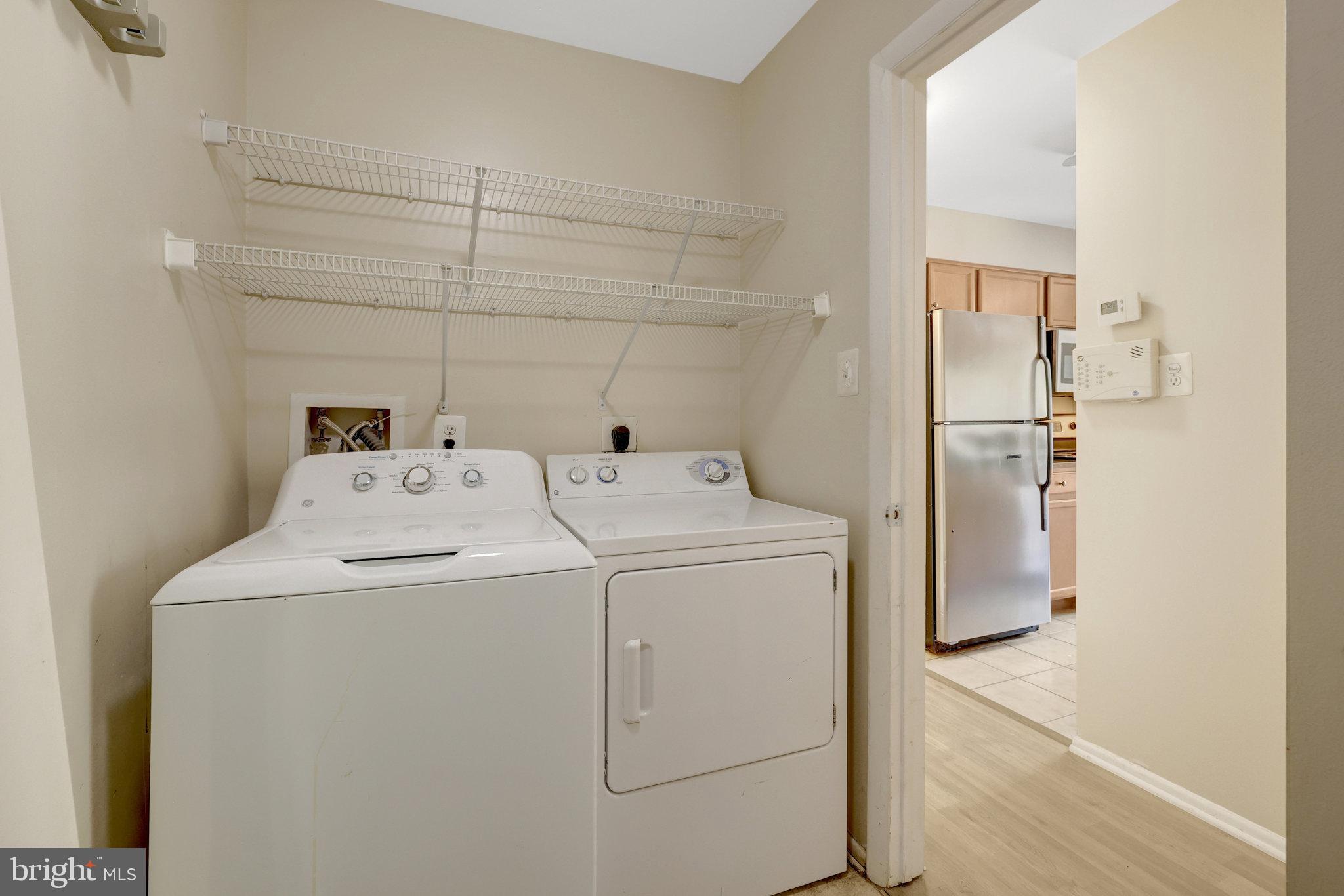 1791 Jonathan Way, Unit 1791B Reston, VA 20190 - Photo 15 of 27 a utility room with dryer and washer