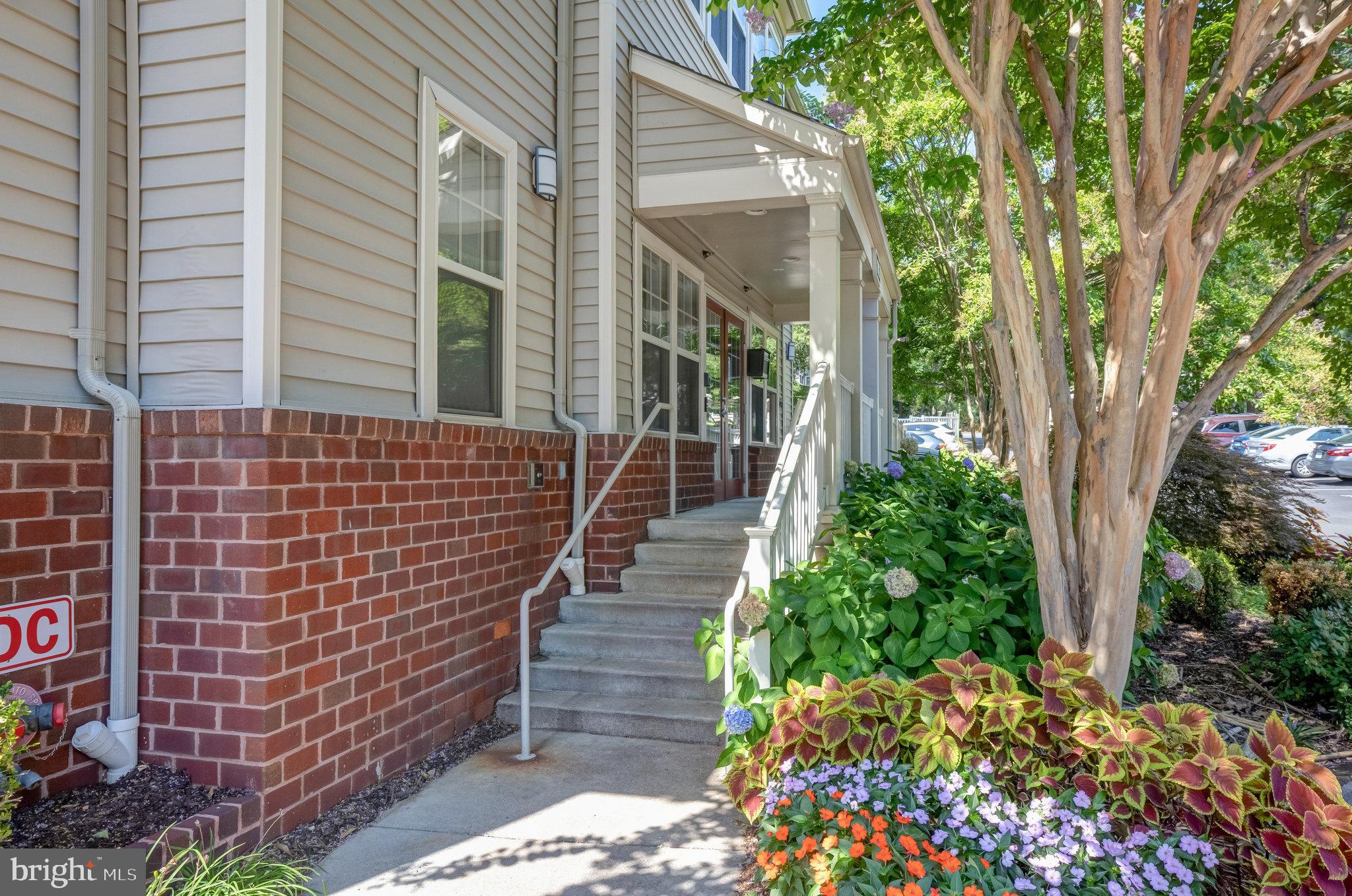 1791 Jonathan Way, Unit 1791B Reston, VA 20190 - Photo 21 of 27 a view of a pathway with a house in the background